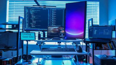 a desk with several computers